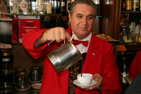 The bartender pours hot chocolate for the festival cameras