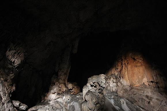 There's a rope in the lower left that one can use to climb into the dark, back recesses of the cave.