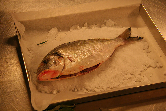 Stuffed with herbs, on a bed of salt.
