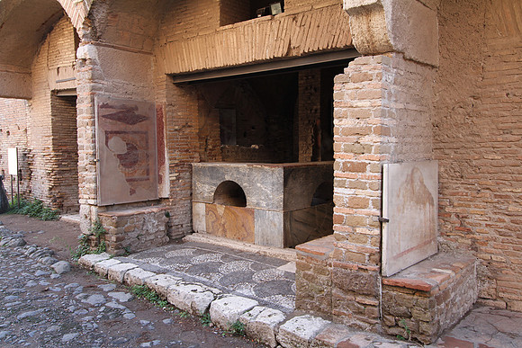 Termopolio - house of the bar. You could get hot and cold food here. Pictures on the wall indicated what was for sale. This is the ground floor of a building with several stories of apartments above.