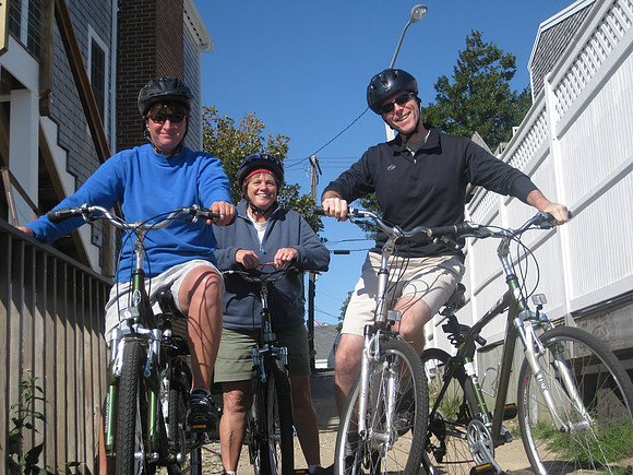 Lisa, Kathy, and Mark touring Provincetown on bikes.