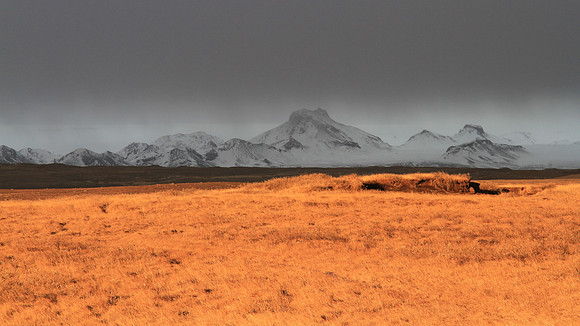 Unprocessed photo, really. The white line that runs more or less flat behind the mountain range is the Langjökull glacier.