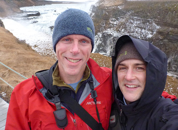 Travelmarx pose at Gullfoss which means "golden falls" for the way light can play off the mist rising from the falls. Not today however.