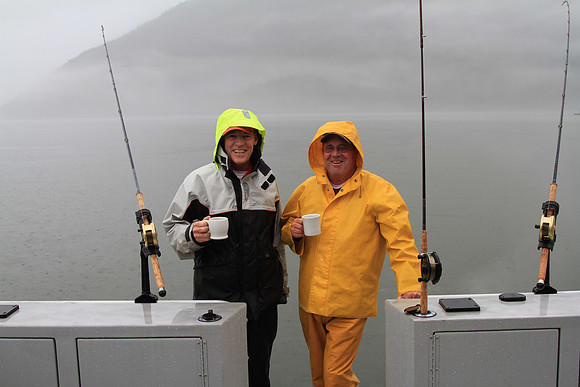 Two very happy fishermen and a very wet day.