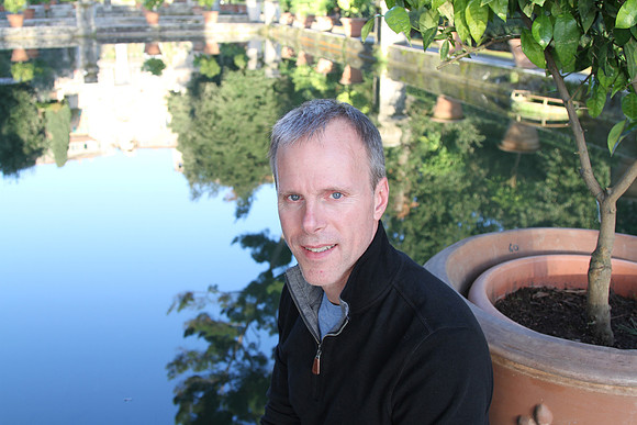 Mark and reflections in the fish pond.