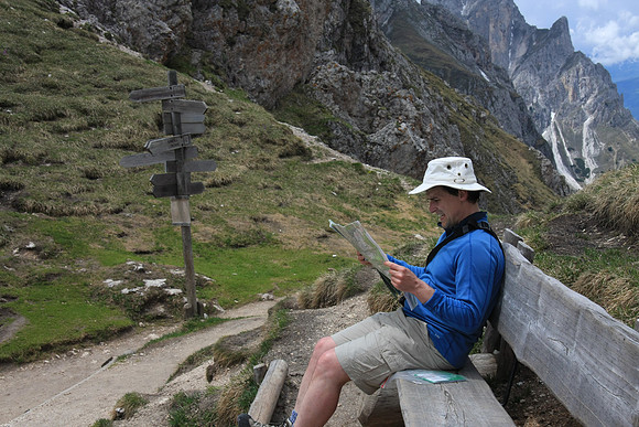 Consulting a map - no wonder, look at the complicated signpost.