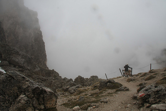 At the end of a pass, crossing a livestock fence. Weather not looking good.