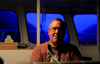 Steve putting final polish on the galley after dinner.