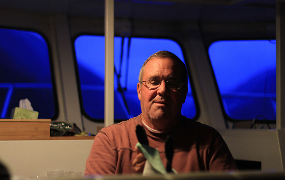 Steve putting final polish on the galley after dinner.