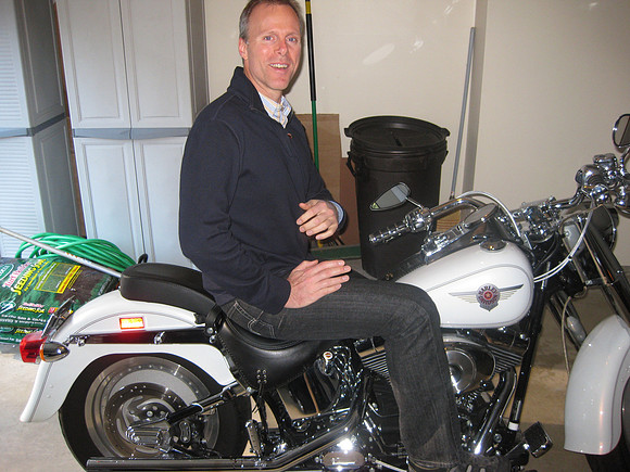 Mark sitting on Scott's Harley
