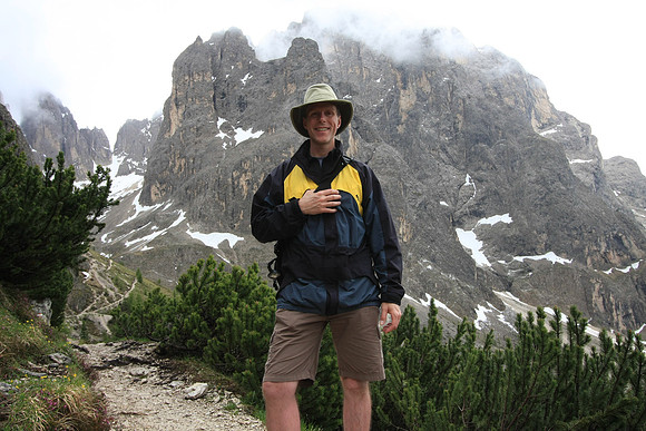 Mark on the trail keeping his camera case dry inside his jacket.