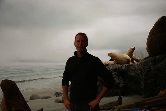 Mark on the beach with seals.
