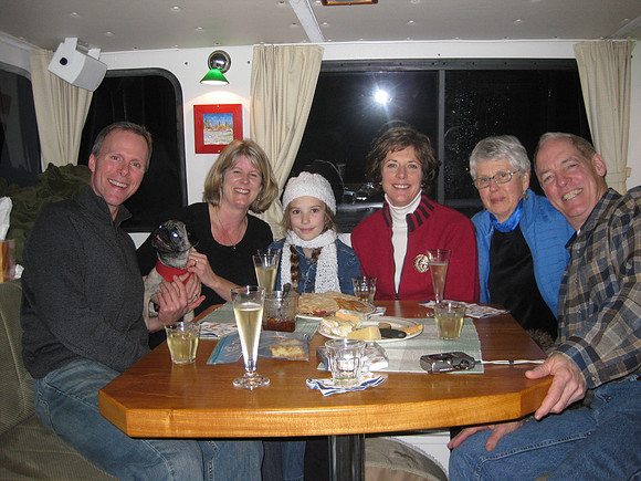 Back on the boat for a some snacks before going out to eat. (That dog looking at Mark is Pugsly.)