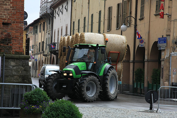 Hay coming through the middle of town
