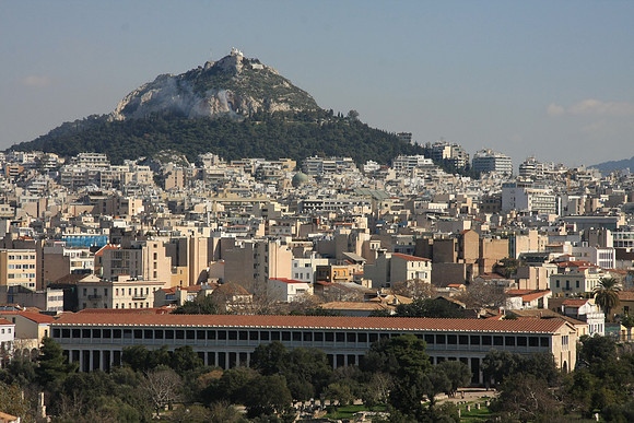 Foreground is Ancient Agora with restored stoa (the long building with columns), an ancient mall.