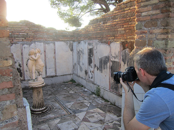 Behind the photographer at Domus di Amore e Psiche - note marble covering left. Used to be everywhere.