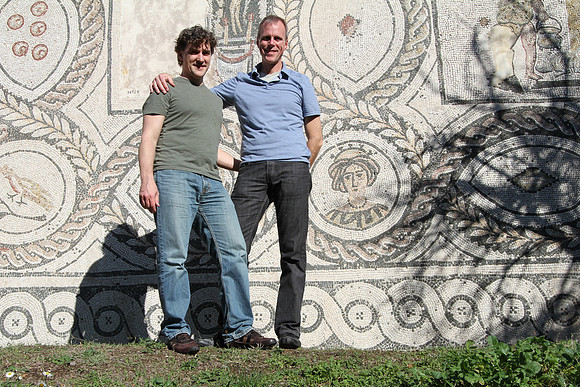 In front of a mosaic wall, but may have been a floor propped up to save or get out of the way during restoration. We don't know.