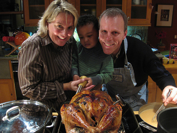 Jenny, Zach and Mark basting the turkey