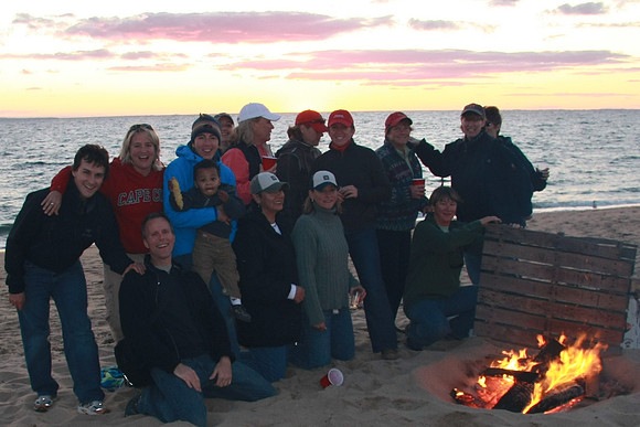 Girl scouts(?) around the camp fire?