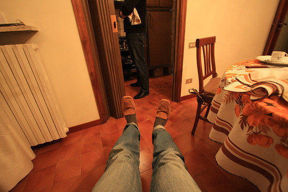 Marc's shoes got dirty so he got a loan of slippers - making himself at home.
