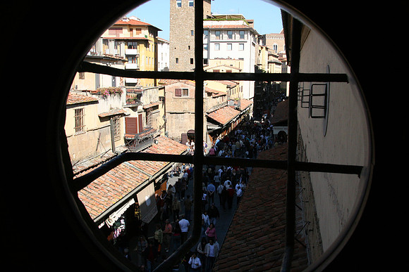 Looking through a window back over the Ponte Vecchio