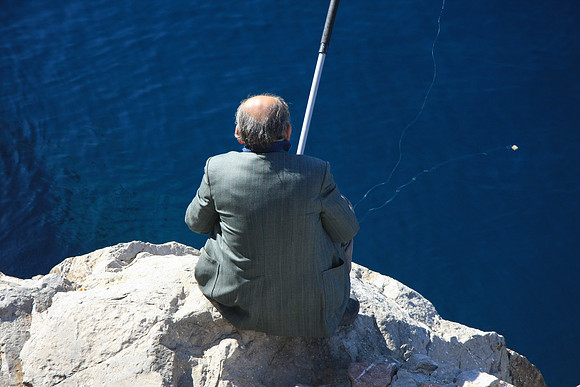 Old man fishes