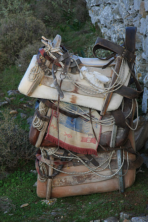 Saddles on the mountain, stacked and ready for use