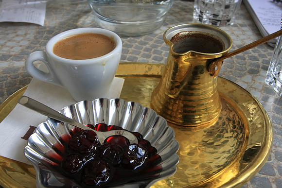 Cafe life is huge in Greece - here Mark enjoys a Greek coffee and some cherries