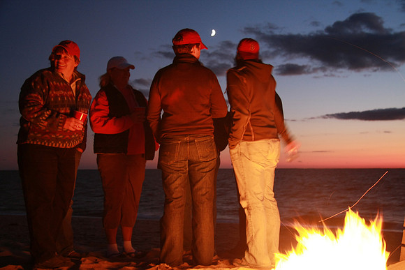 Moon, beach, fire.