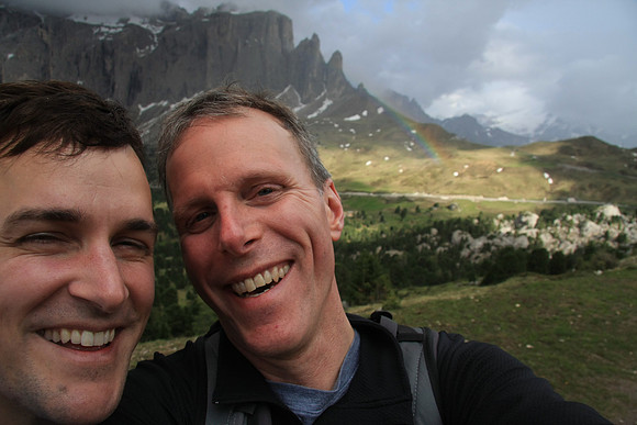Travelmarx with a rainbow in the background.