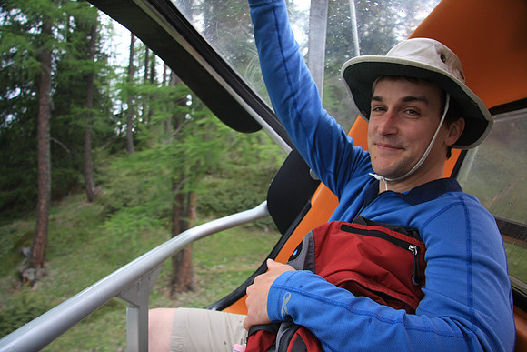 On the way down, it's starting to rain. Marc closing the lid on the chair.
